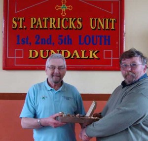 Stephen Coffey presenting a trophy to St Patrick's unit 1st 2nd 5th boy scouts DUNDALK.
